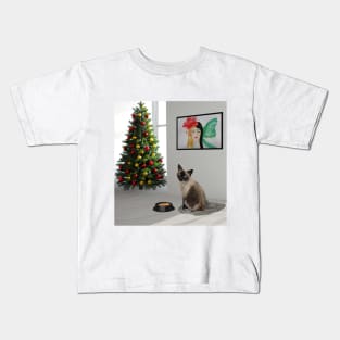 Siamese cat sitting in the white room with food and Christmas tree Kids T-Shirt